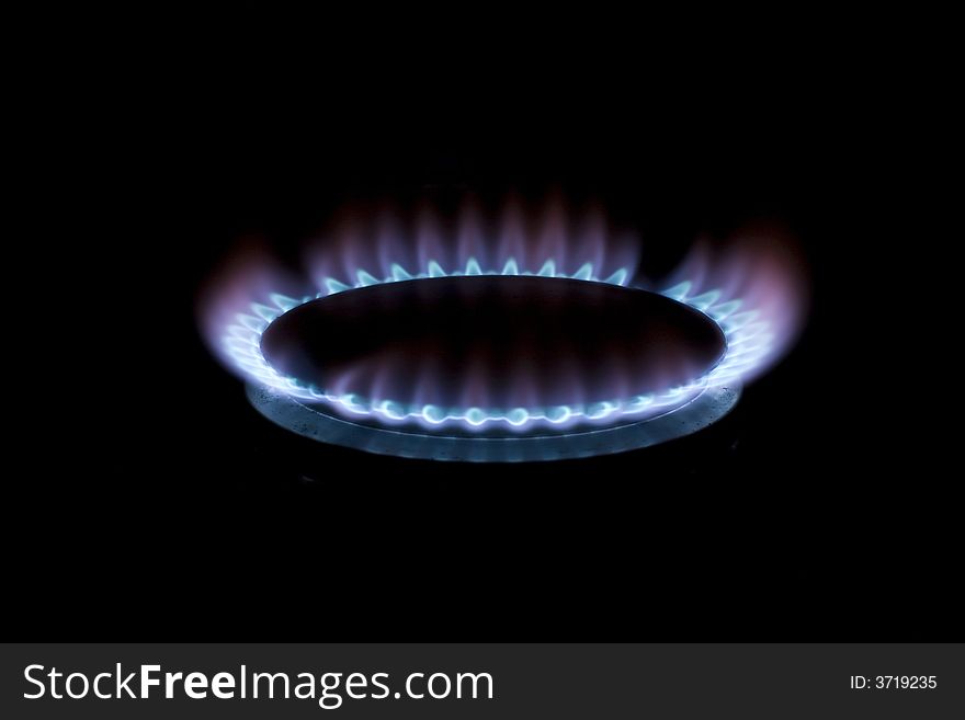 A burning gas hob in the dark