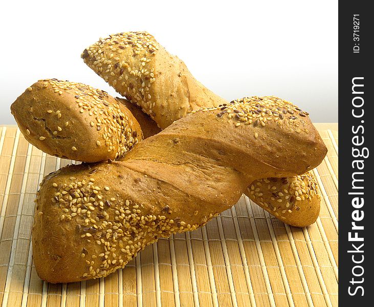 Three different kind of bread on a wood background