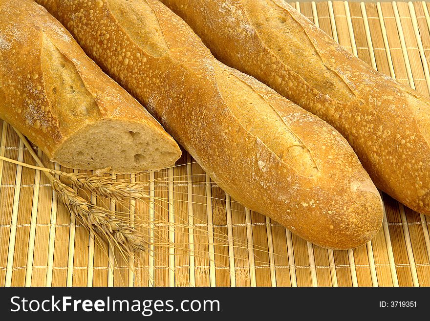 Three different kind of bread on a wood background