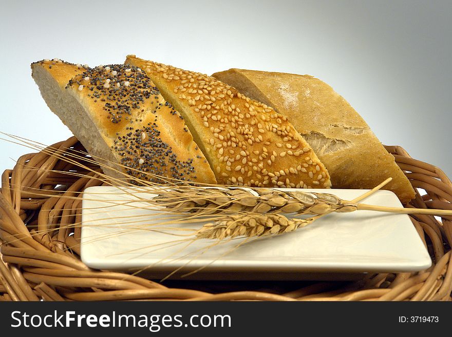 Three slice of different kind of bread on a wood background