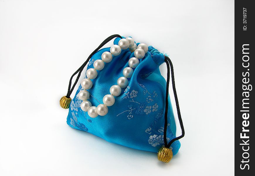 Blue gift bag on white background with pearl. Blue gift bag on white background with pearl