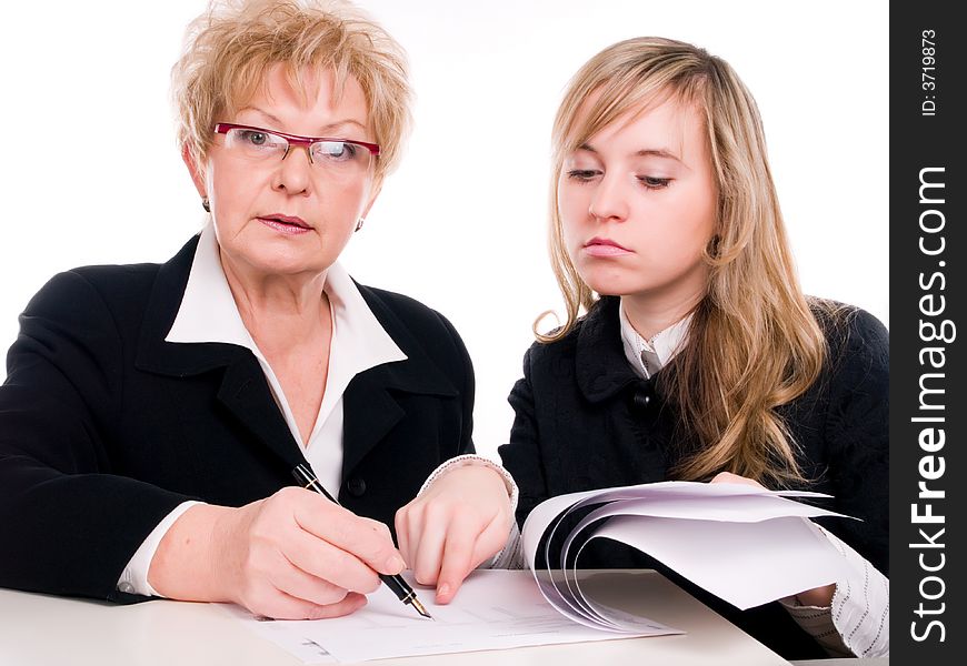 Businesswoman looking at important documents together. Businesswoman looking at important documents together