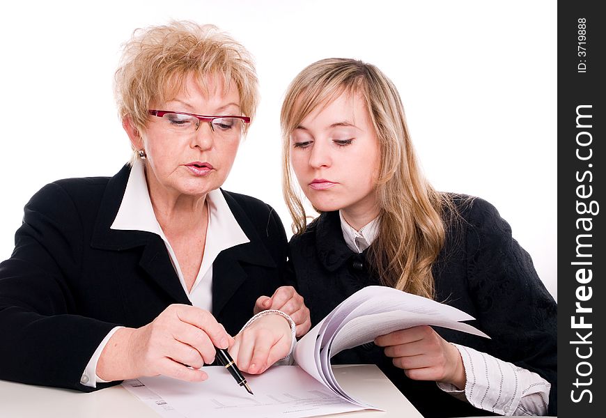 Businesswoman looking at important documents together. Businesswoman looking at important documents together