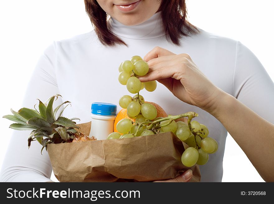 Pretty girl with package of  purchases, isolated. Pretty girl with package of  purchases, isolated