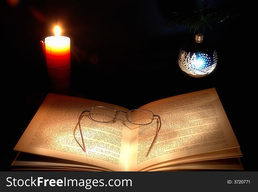 Beautiful candle and book composition for the christmas. Beautiful candle and book composition for the christmas