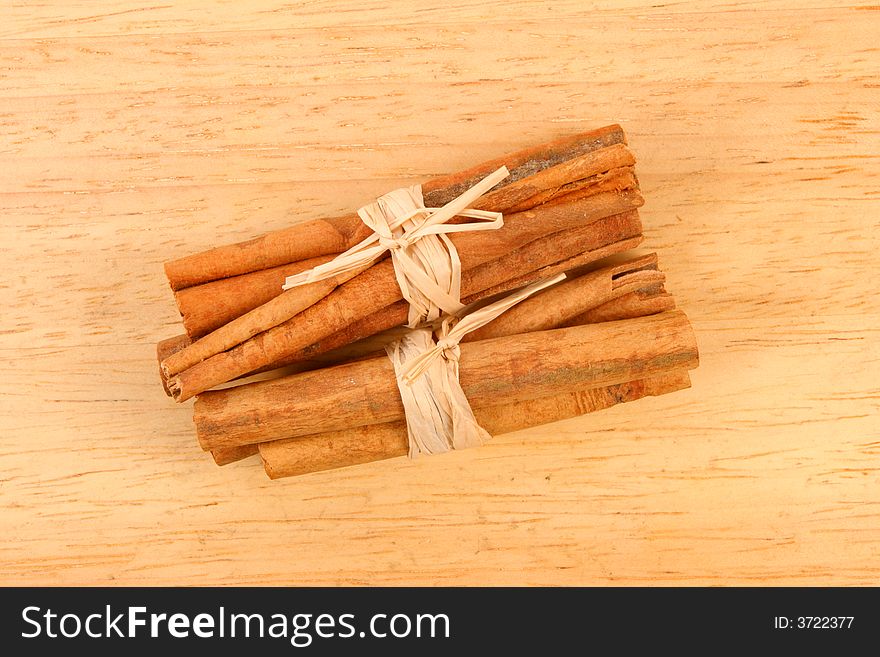 Cinnamon sticks on a wood background. Cinnamon sticks on a wood background