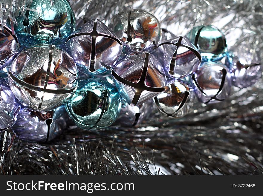 Jingle bells and tinsel for Christmas background.