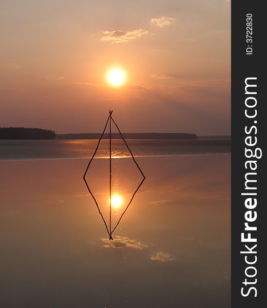 This strange construction was installed in winter on ice by a fisherman. In spring ice melted but construction still lives. This strange construction was installed in winter on ice by a fisherman. In spring ice melted but construction still lives.