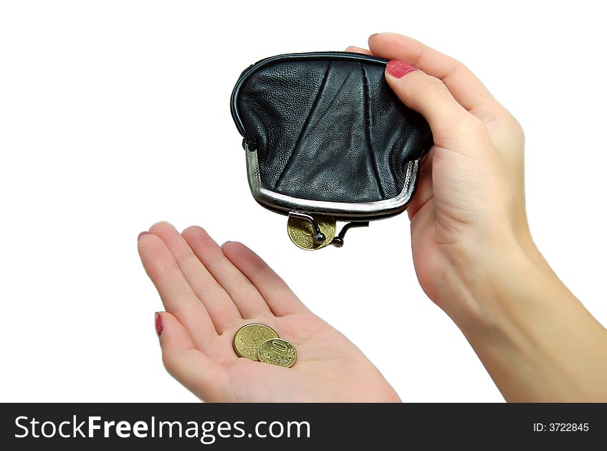 Female hands holding leather purse and falling coins