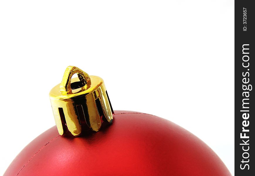 Red christmas bauble fragment at the white background