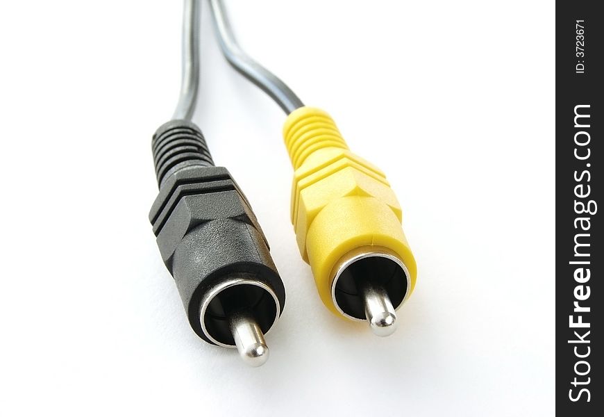 Audio video cable fragment with black and yellow plugs. Audio video cable fragment with black and yellow plugs