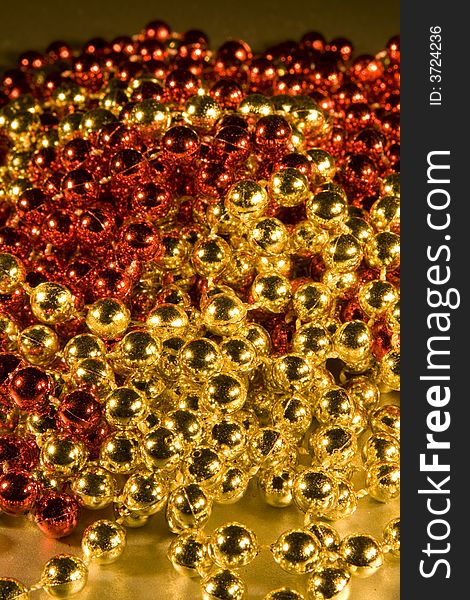 Shiny Beads for background Christmas design element, selective focus & depth of field used to create differing moods of shot.