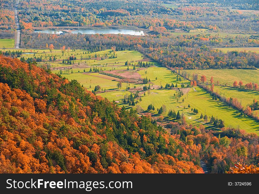 Golf course viewed from above in fall nature. Golf course viewed from above in fall nature