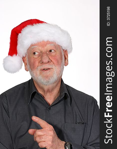 Mature man with white beard and Santa hat waving his finger. Mature man with white beard and Santa hat waving his finger