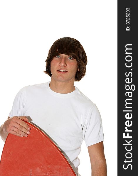 Teenage boy peeking with his boogie-board. Teenage boy peeking with his boogie-board