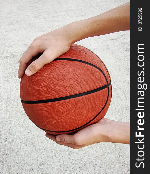 Man Holding Basketball Ready To Dribble