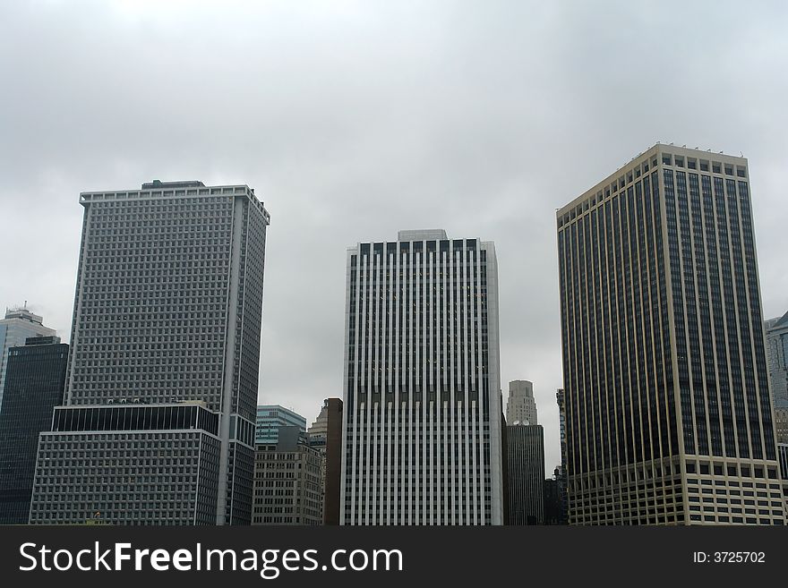 A picture of three skyscrapers nearly equal in height. A picture of three skyscrapers nearly equal in height