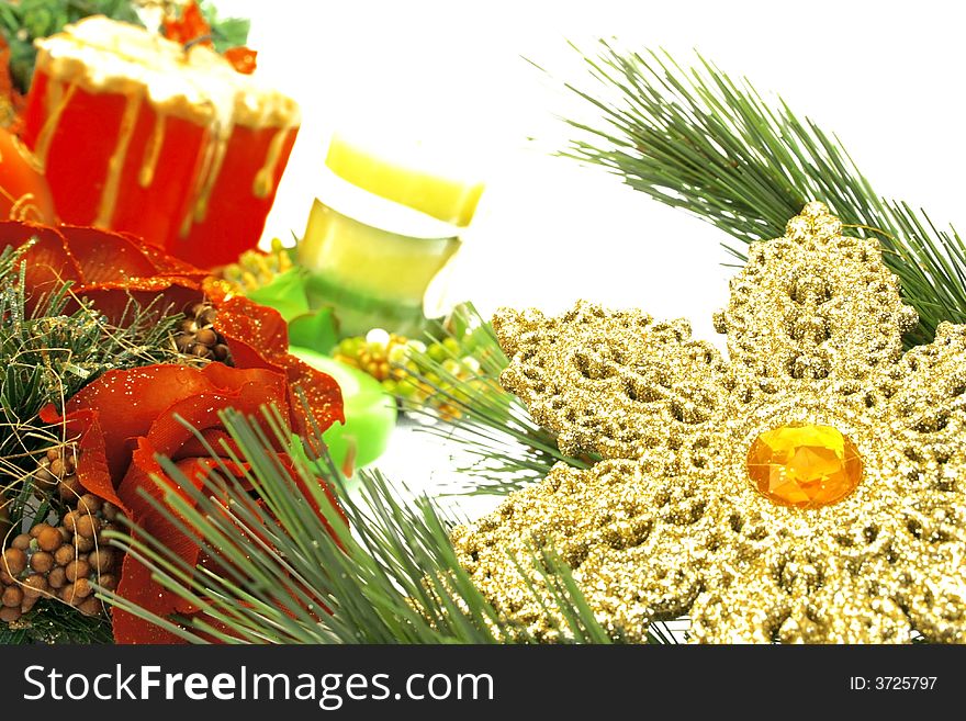 Christmas ornaments,yellow snow flake,candles,rose,fir-tree.