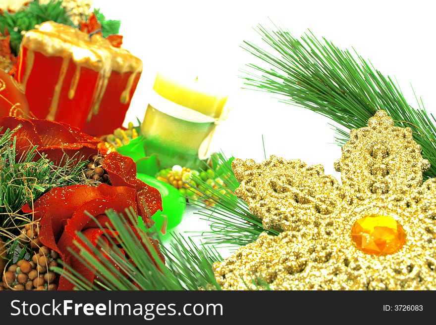 Christmas ornaments,yellow snow flake,candles,rose,fir-tree.