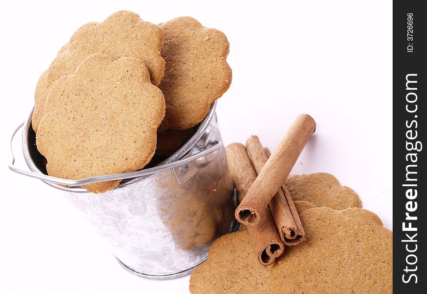 Bowl of delicious cookies on the white background