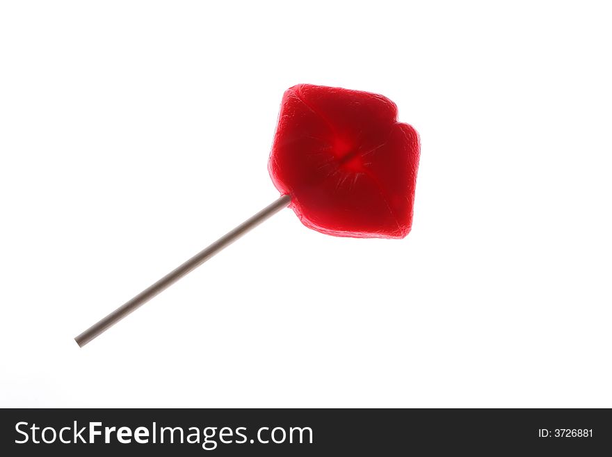 Lollipop in the shape of red lips, shot on white. Lollipop in the shape of red lips, shot on white