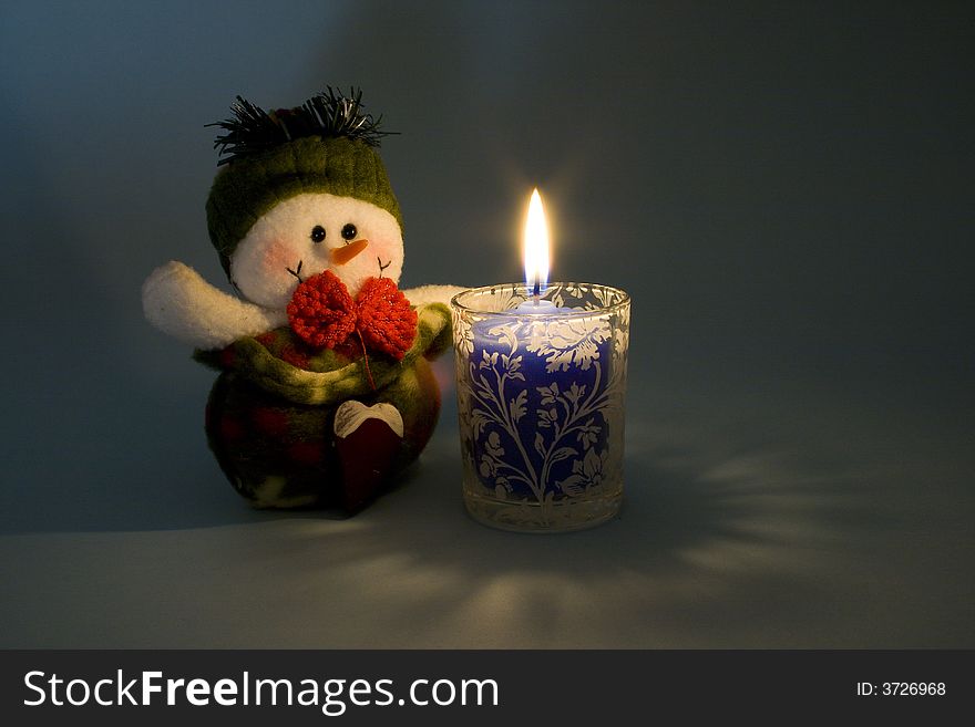 Snowman In Candlelight