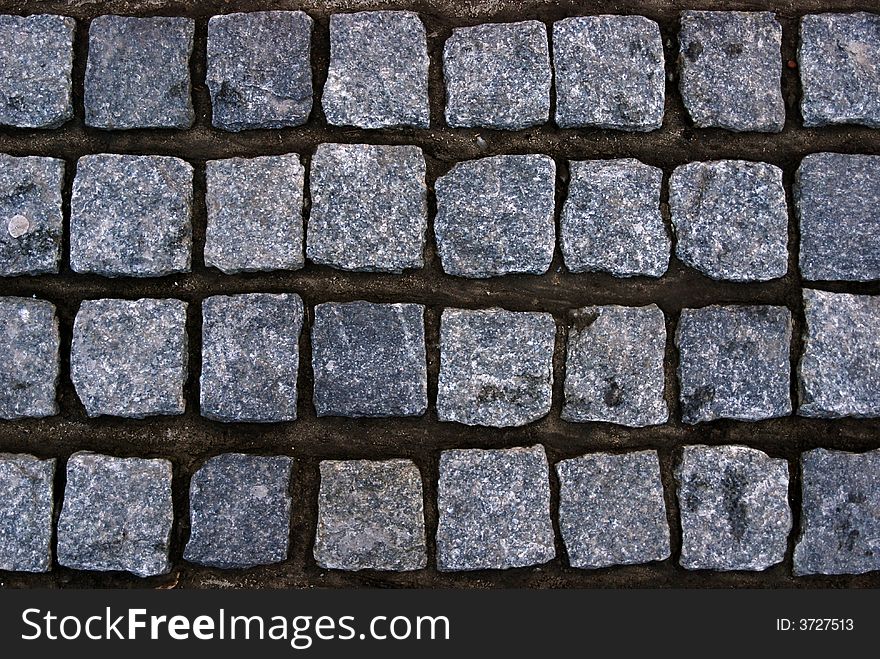 Vintage stone block paving background