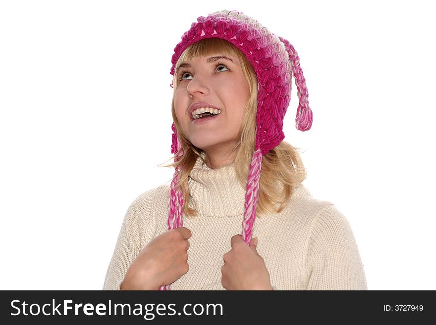 Smiling blond girl in cap is looking up