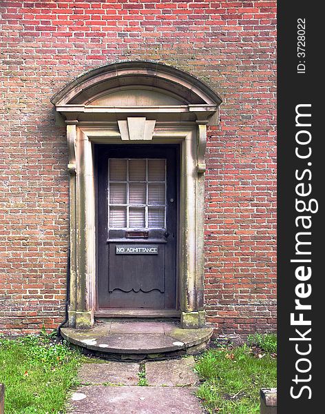Old ornamental entrance door with No Admittance sign. Old ornamental entrance door with No Admittance sign