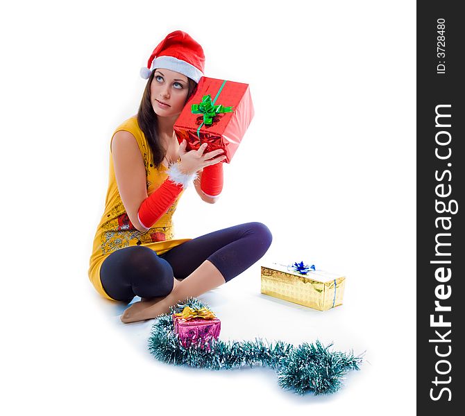 Christmas girl holding a gift box over white