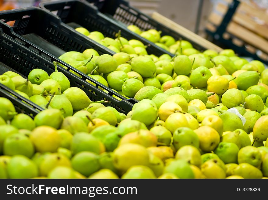 Heaps of pears on sale in a asupermarket. Heaps of pears on sale in a asupermarket