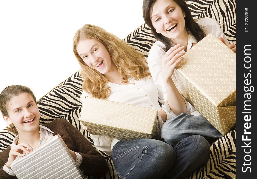 Three girls on the sofa with gifts. Three girls on the sofa with gifts