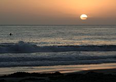 Surfer Watching A Sunset Stock Photo Surfer Watching A Sunset Stock Photo