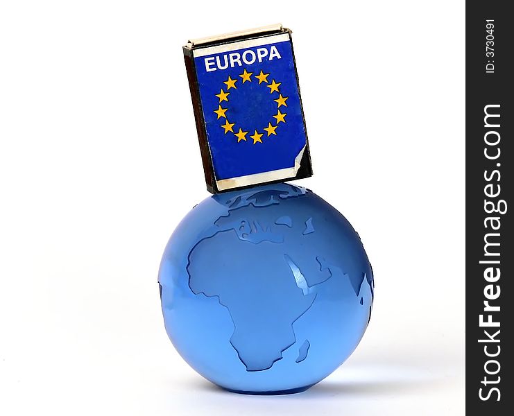 Europa unin flag on a matchbox and a glass globe. Europa unin flag on a matchbox and a glass globe