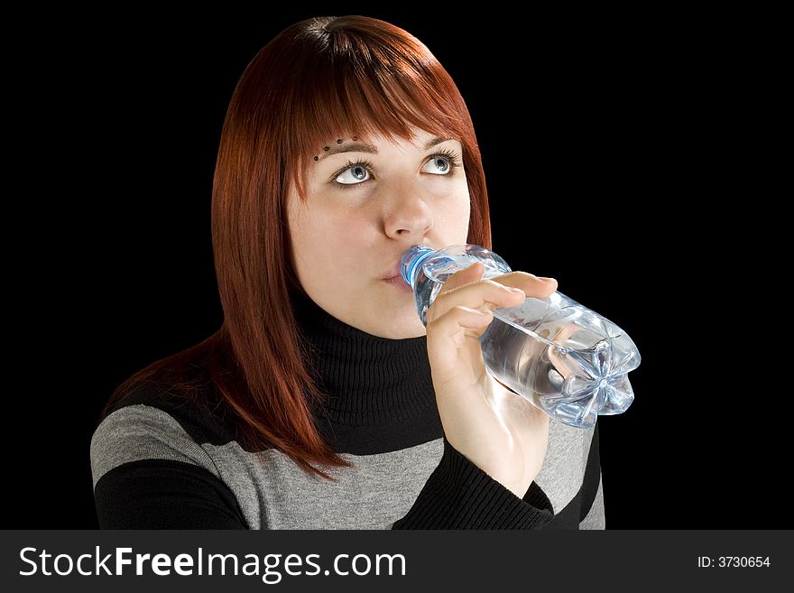 Redhead girl drinking water