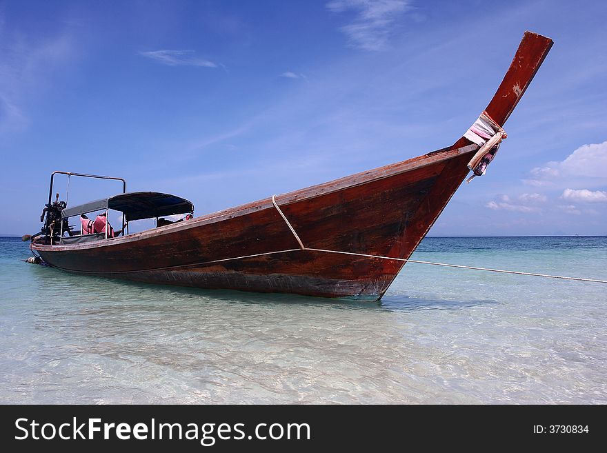 longtail boat from thailand with blue sky