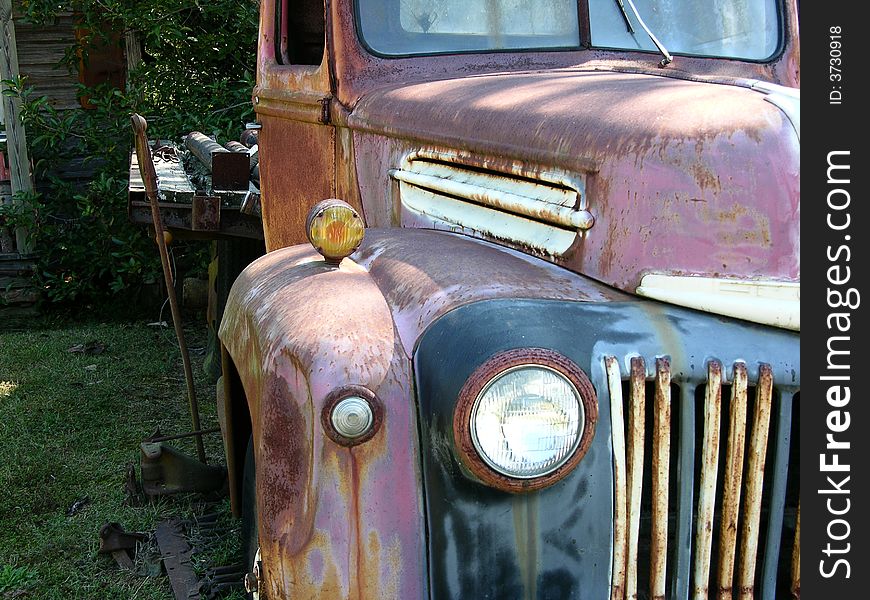 Old rusted truck near old house. Old rusted truck near old house.