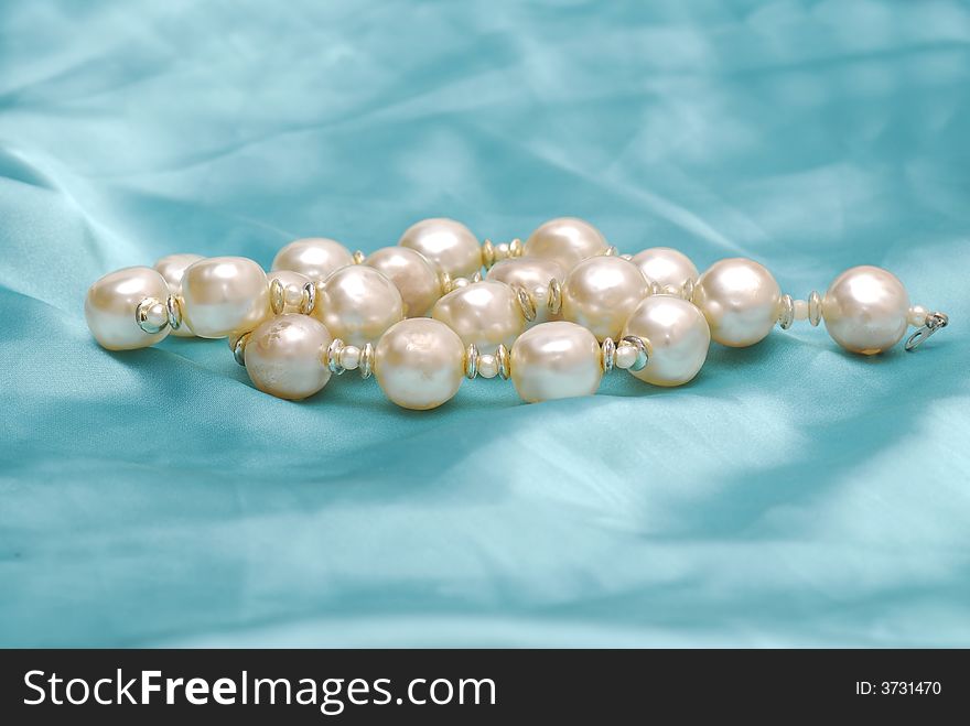 Image of pearls on blue background