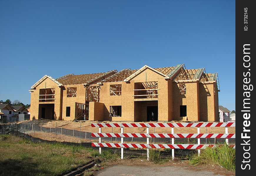 new home building site that has a road block. new home building site that has a road block