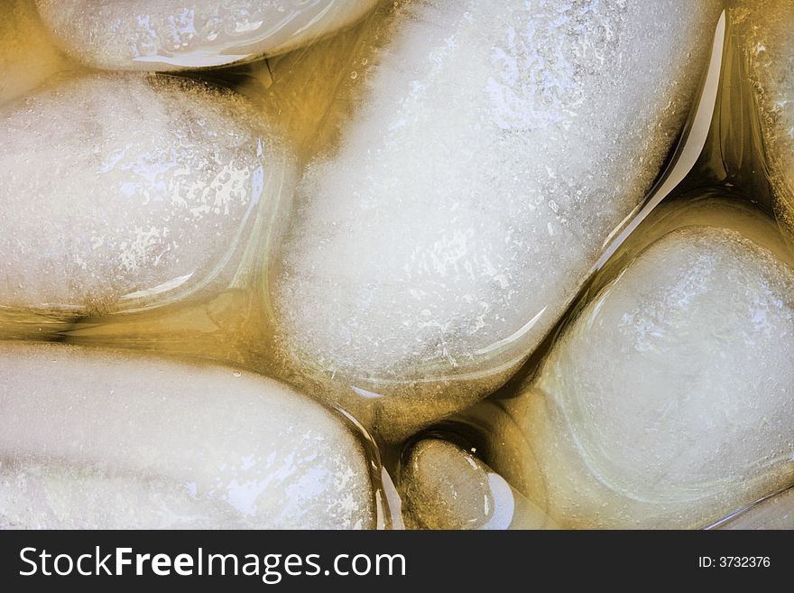 Close up of ice cubes in a glass of iced tea. Close up of ice cubes in a glass of iced tea