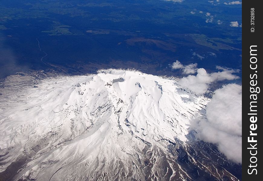 Airplane And Snow Mountain