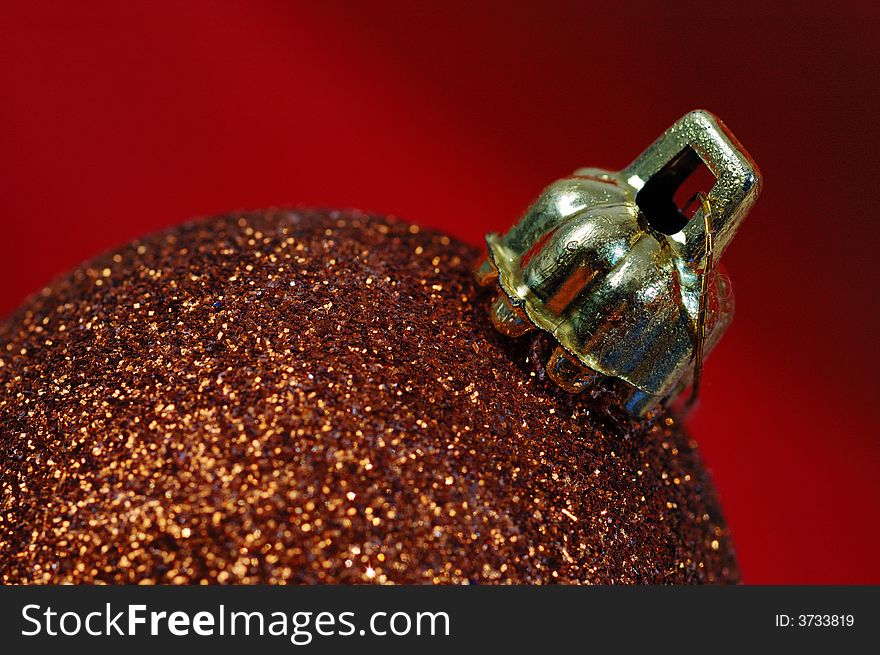 Christmas-tree decorations over red background. Close-up. Christmas-tree decorations over red background. Close-up.