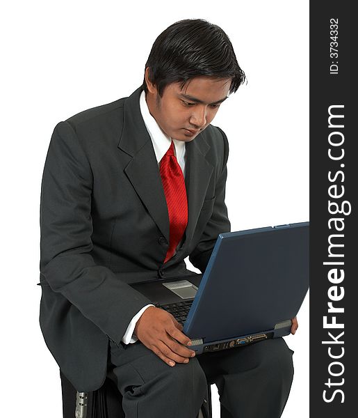 A man sitting on his luggage over a white background. A man sitting on his luggage over a white background