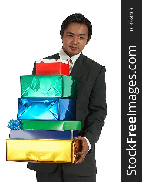 A man carrying some gift boxes over a white background. A man carrying some gift boxes over a white background