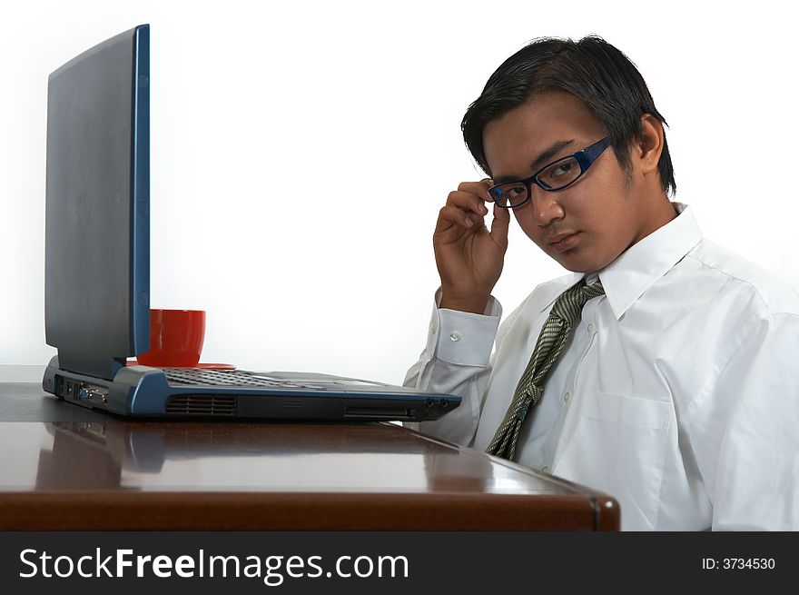 Young businessman working on his laptop computer