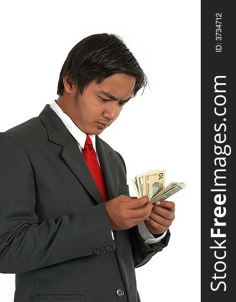 A man counting his money over a white background. A man counting his money over a white background