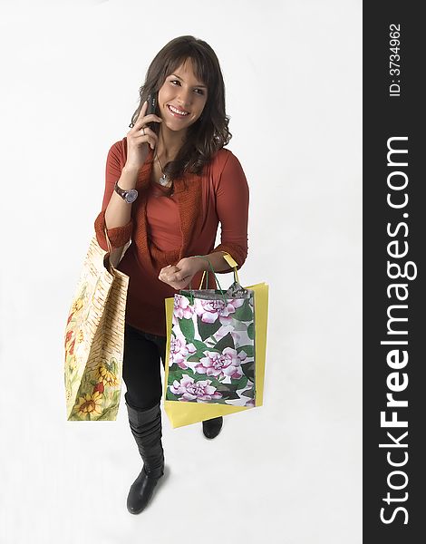 Woman With Bags And Cellular Phone