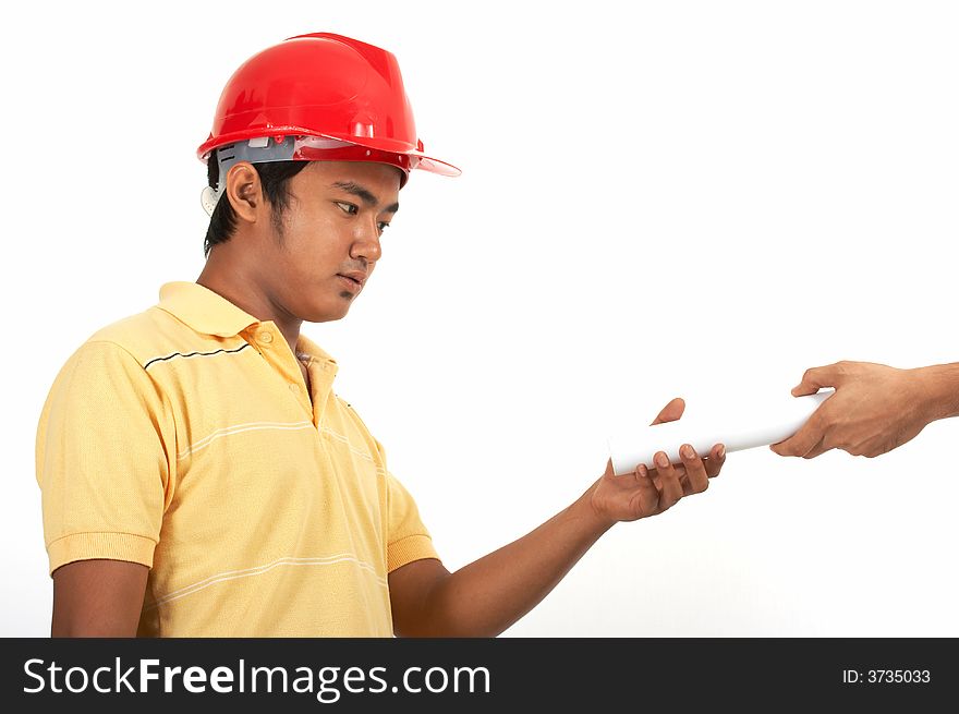 A man wearing a hard hat over a white background. A man wearing a hard hat over a white background