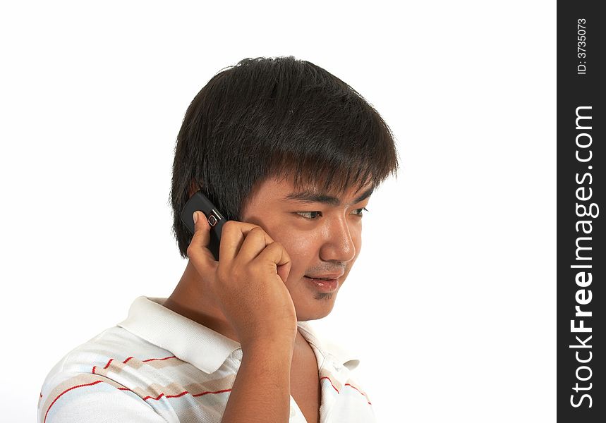 Man talking on phone over a white background. Man talking on phone over a white background