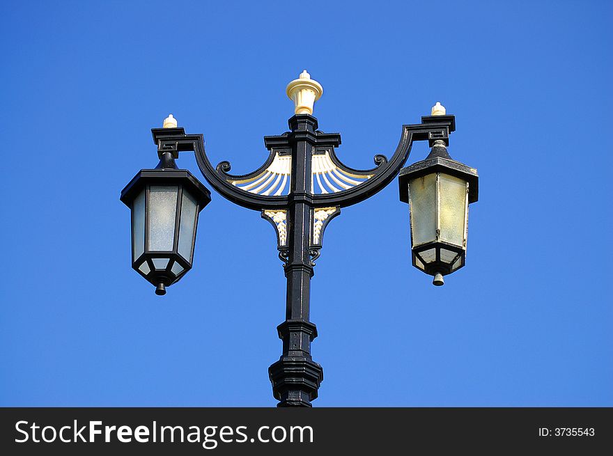 Victorian street light against blue sky